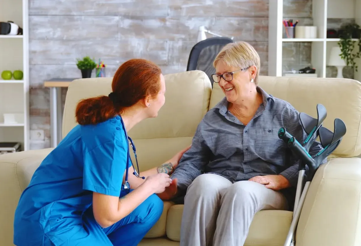 female nurse talking with old woman - elderly care in abu dhabi